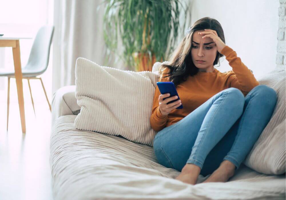 woman holding a phone