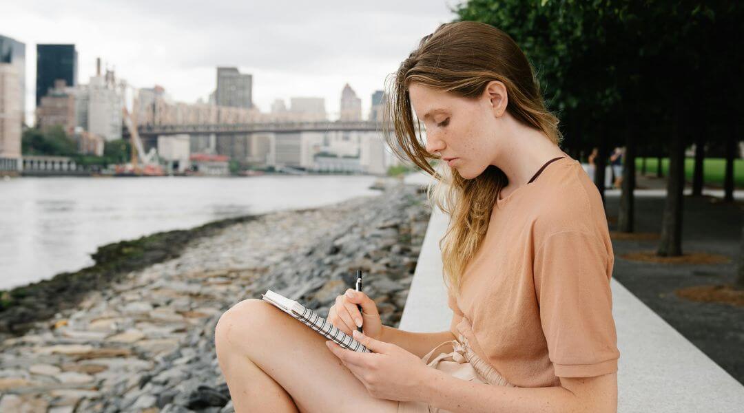lady writing on her journal